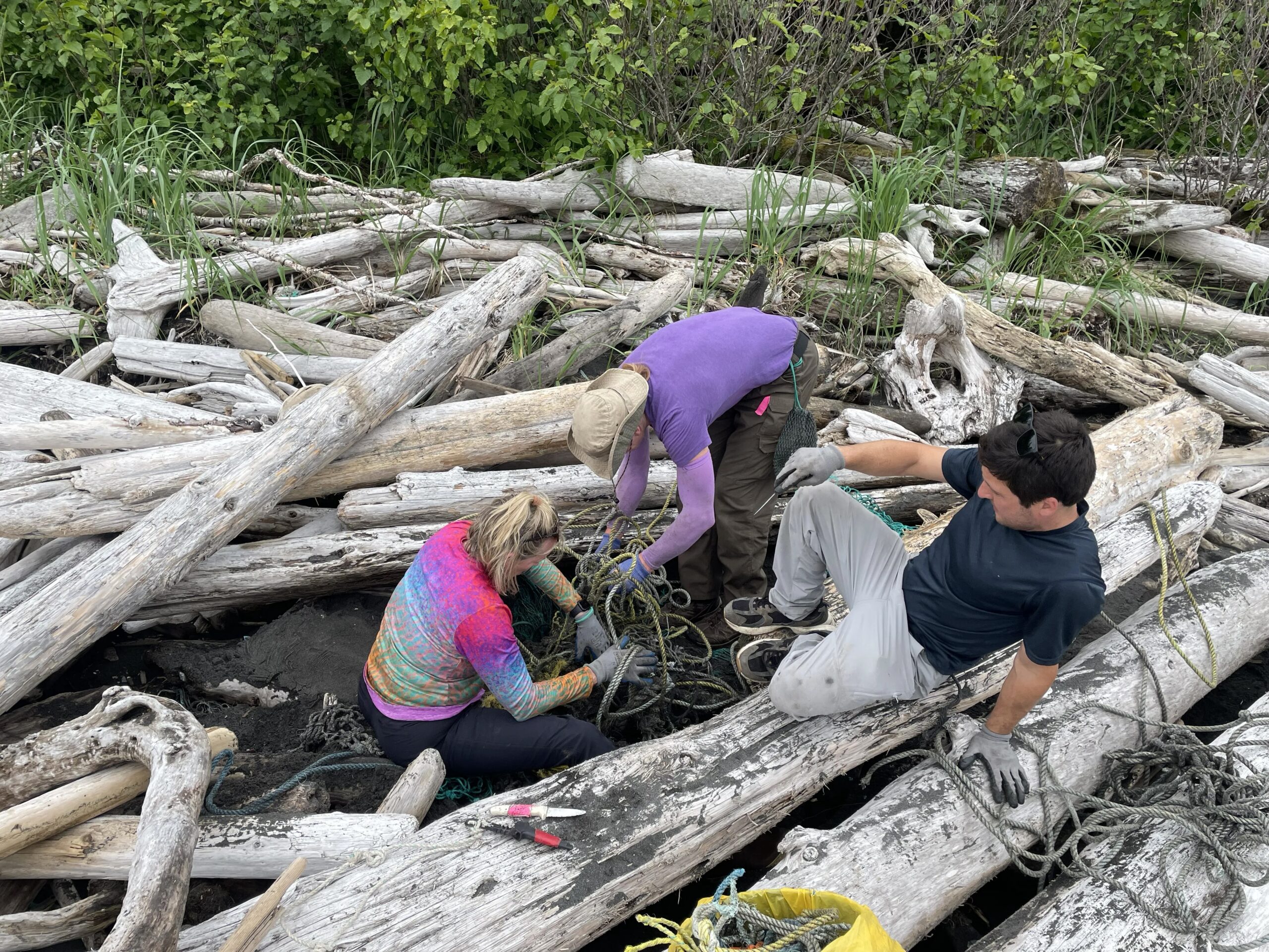 Cleanup crew hauling marine debris from the Alaskan shoreline